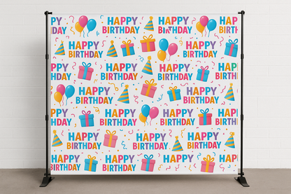 Birthday-themed backdrop with colorful text and graphics on a white background