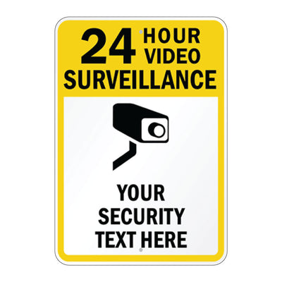 A rectangular yellow and white sign with rounded corners featuring the text '24 HOUR VIDEO SURVEILLANCE' in black, a black security camera icon, and 'YOUR SECURITY TEXT HERE' on a white background.