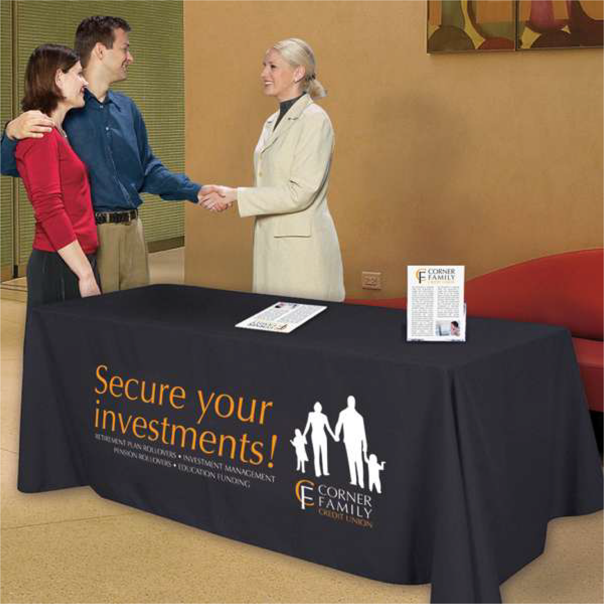 Black custom 6-foot table throw with gold and white logo used at a corporate networking seminar.