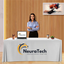Custom white 6-foot table throw with black business logo for professional indoor events.