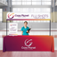 Professional red gradient 8-foot custom table throw used for a healthcare clinic event display.
