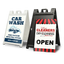 Two portable plastic A-frame signs for business, one white car wash sign and one black dry cleaners open sign.
