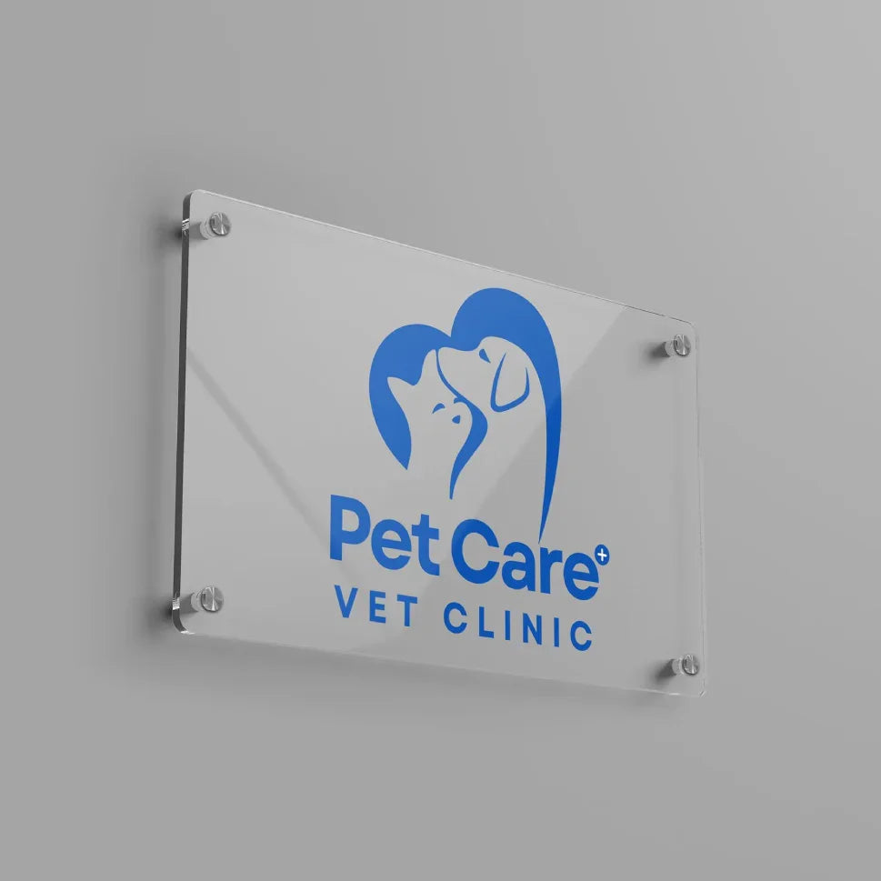 Professional clear acrylic vet clinic sign with custom blue animal logo.