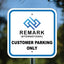 Professional blue and white reflective aluminum customer parking only sign with custom company logo for a business lot.
