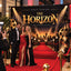 Professional red carpet step and repeat backdrop banner for a movie premiere featuring gold "World Premiere" typography and elegant spotlight effects.