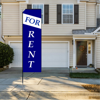A tall blue rectangle advertising flag with white "For Rent" text standing on a residential driveway next to a house garage.