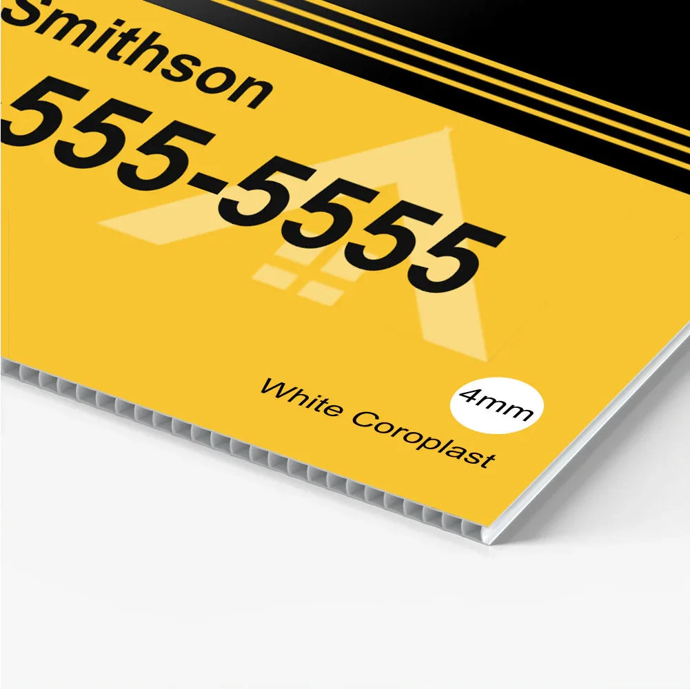 Close up of a custom yellow corrugated plastic yard sign with black text and fluted ridges.