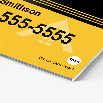 Close up of a custom yellow corrugated plastic yard sign with black text and fluted ridges.