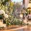 An elegant clear acrylic wedding welcome sign featuring custom white lettering for Olivia and Daniel with a June 15, 2024 wedding date, displayed outdoors surrounded by white floral arrangements and warm candlelight.