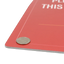 Close-up shot of a red rigid PVC plastic sign with a quarter placed on top to illustrate material thickness and durability.⁠
