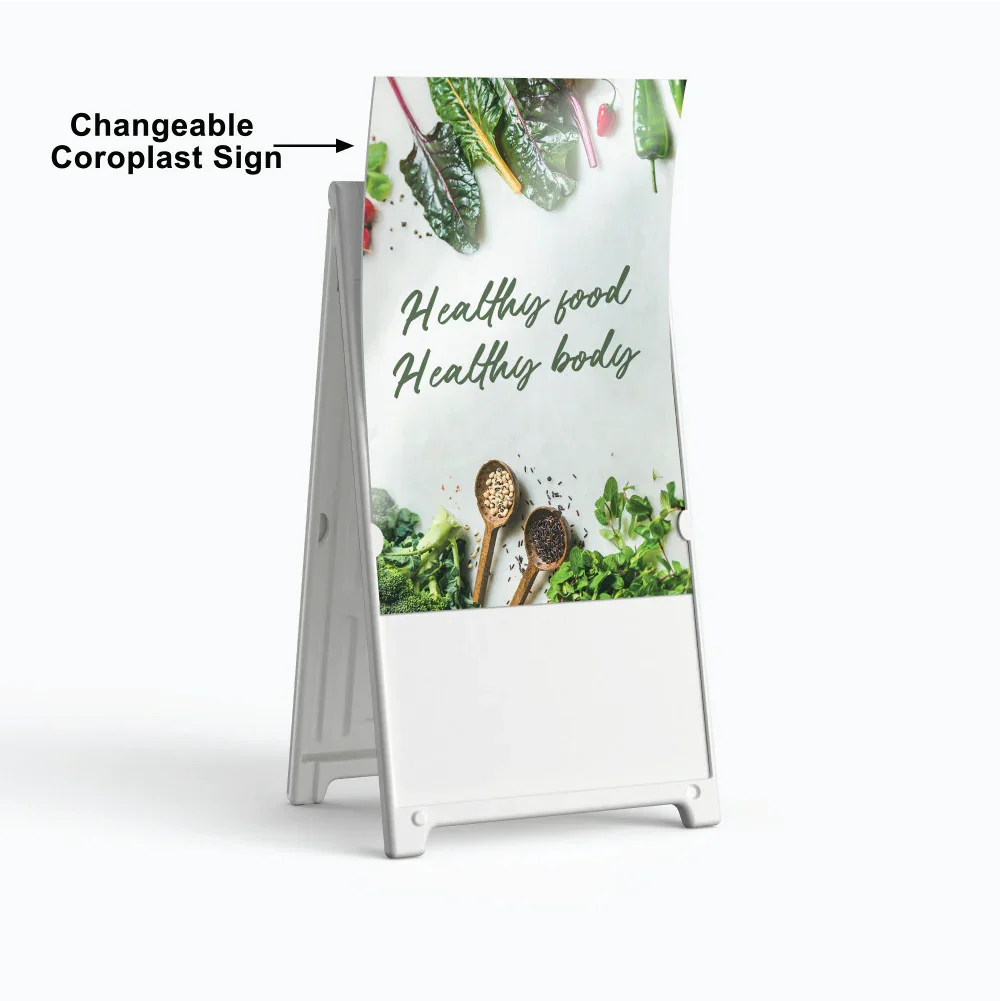Tall white plastic sandwich board with a vertical green health and wellness coroplast sign insert for outdoor retail use.