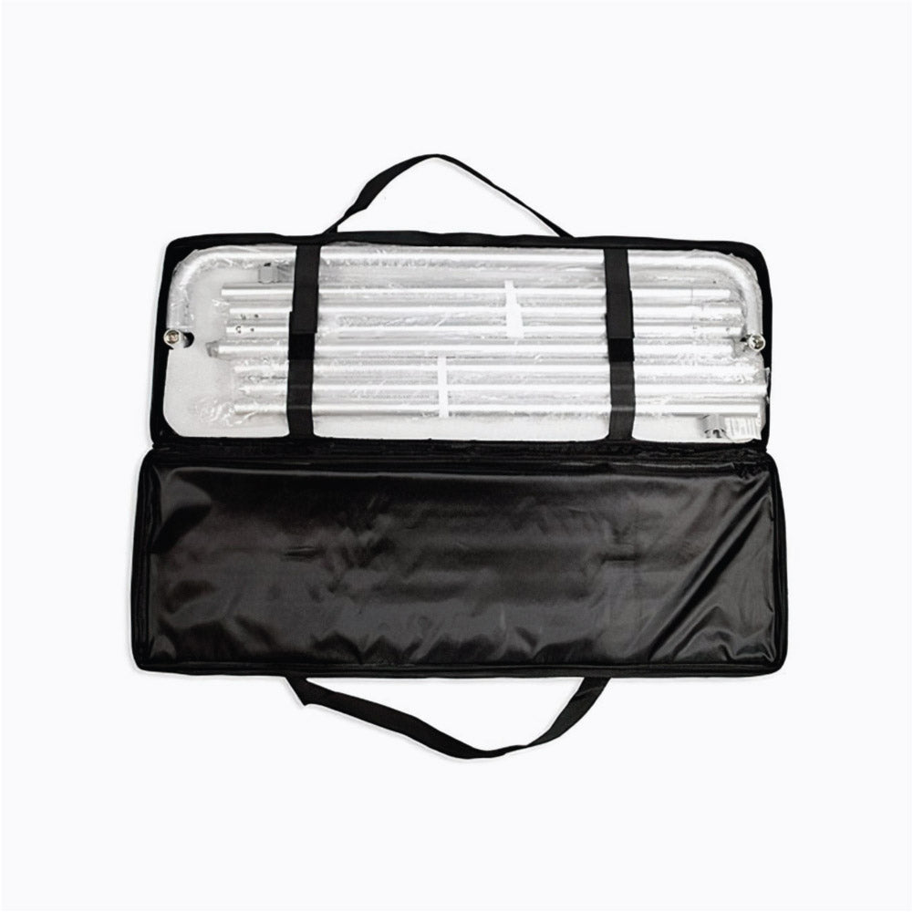 Black complimentary carrying case open with packed interlocking aluminum tube frame components for a tension fabric stand display