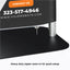 Close-up view of the heavy-duty zipper sewn into the bottom of a tension fabric stand graphic above the steel base plate
