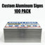 A stack of custom aluminum safety signs with a 'SAFETY FIRST' sign on top, shown against a white background with the text 'Custom Aluminum Signs 100 PACK' above it.