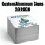 A stack of custom aluminum park entrance signs on a white background, with large text at the top reading 'Custom Aluminum Signs 50 PACK'. The top sign shows the Riverside Outdoors logo and the text 'Trail Maps & Information Park Entrance'.